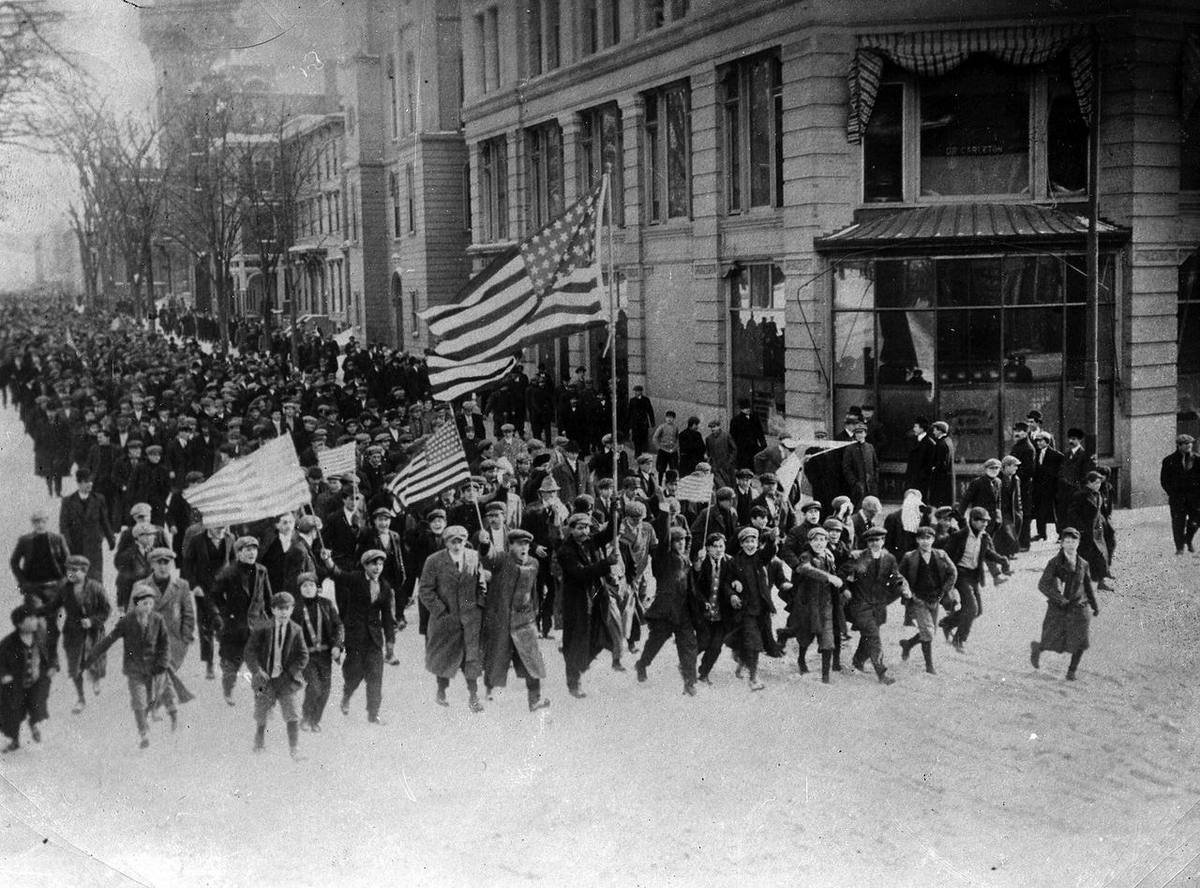 A large procession of textile strikers marching through Lawrence, Massachusetts, in 1912.