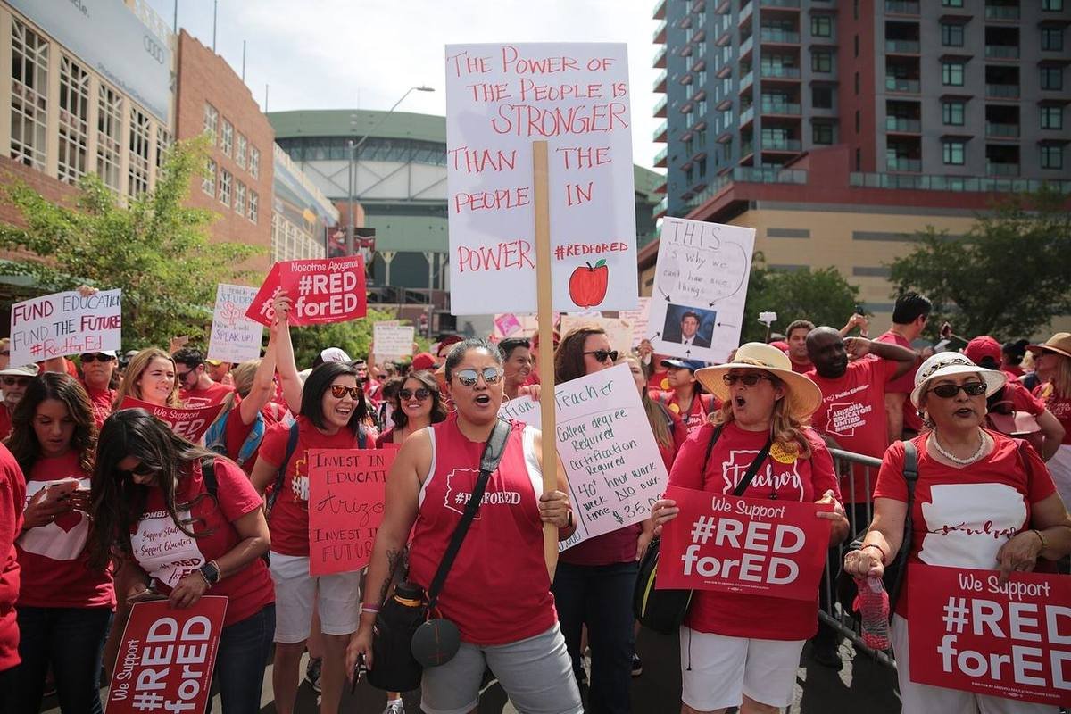 Arizona educators and supporters, many dressed in red, filling the grounds outside the state capitol during the April 2018 teacher walkout.